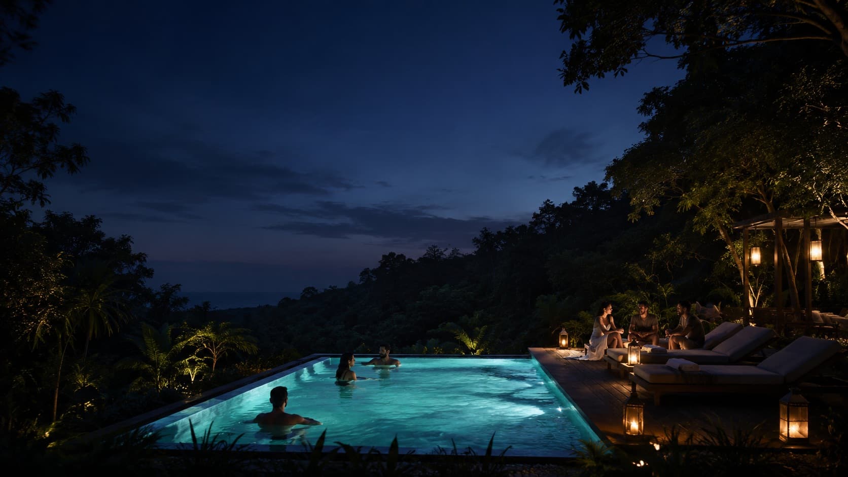 A retreat pool at dusk, lanterns on the deck